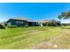 A beautiful, spacious backyard offers an expansive lawn, perfect for outdoor activities and relaxation at 4308 Fly Rod Ter, Parrish, FL 34219