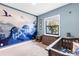 Nicely decorated Bedroom room featuring a crib, and a dresser at 4308 Fly Rod Ter, Parrish, FL 34219
