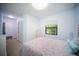 Well-lit bedroom featuring a full bed, side tables, and closet at 4308 Fly Rod Ter, Parrish, FL 34219