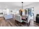 Open concept space featuring a dining table and chairs adjacent to a modern white kitchen at 4308 Fly Rod Ter, Parrish, FL 34219