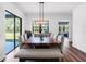 Dining table with chairs in an open room, with a patio view visible through windows at 4308 Fly Rod Ter, Parrish, FL 34219