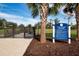 Gated community dog park with lush green space, rules signage, and tropical landscaping for residents and their guests at 4308 Fly Rod Ter, Parrish, FL 34219