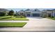 Charming single-story home featuring a two-car garage, well-manicured lawn, and inviting curb appeal at 4308 Fly Rod Ter, Parrish, FL 34219