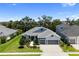 Landscaped home featuring well manicured grass and beautiful blue and white color scheme at 4308 Fly Rod Ter, Parrish, FL 34219