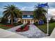 The Gathering Place features a charming exterior, with manicured landscaping, a stone walkway and inviting porch at 4308 Fly Rod Ter, Parrish, FL 34219