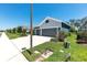 View of a two-car garage home with a concrete driveway and well-maintained lawn at 4308 Fly Rod Ter, Parrish, FL 34219