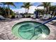Inviting hot tub featuring a safety rail and surrounding lounge chairs offers a relaxing oasis at 4308 Fly Rod Ter, Parrish, FL 34219