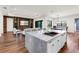 Open-concept kitchen features a large island, modern appliances, and seamless flow to living spaces at 4308 Fly Rod Ter, Parrish, FL 34219