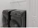 Laundry room featuring black front load washer and dryer at 4308 Fly Rod Ter, Parrish, FL 34219