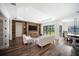 Elegant living room boasts a stone accent wall, fireplace, hardwood floors, and an open layout at 4308 Fly Rod Ter, Parrish, FL 34219