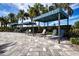Outdoor lounge area with comfortable seating, shaded by modern awnings, offers a relaxing retreat at 4308 Fly Rod Ter, Parrish, FL 34219