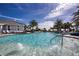 Sparkling pool featuring fountains, clear blue water, and tropical landscaping offers a serene escape at 4308 Fly Rod Ter, Parrish, FL 34219