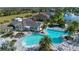 Aerial view of the pool with palm trees, lounge chairs and seating areas creating a relaxing environment at 4308 Fly Rod Ter, Parrish, FL 34219
