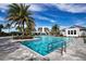 Resort-style pool featuring a unique shape, lounge chairs, and lush tropical landscaping creates a stunning setting at 4308 Fly Rod Ter, Parrish, FL 34219