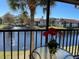 Relaxing screened balcony with a view of the lake, complete with a table and chairs for outdoor enjoyment at 4325 46Th W Ave # 202, Bradenton, FL 34210