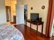 Well-lit bedroom view to bathroom access and view to entertainment area at 4325 46Th W Ave # 202, Bradenton, FL 34210