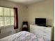 This bedroom has bright natural light from the window and a white dresser to store your belongings at 4325 46Th W Ave # 202, Bradenton, FL 34210