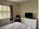 This bedroom has bright natural light from the window and a white dresser to store your belongings at 4325 46Th W Ave # 202, Bradenton, FL 34210
