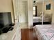 Bedroom with a large window, curtains, and a bed with a patterned bedspread at 4325 46Th W Ave # 202, Bradenton, FL 34210