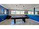 Features a well-lit game room with a pool table, tiled floor, and neutral color scheme at 4325 46Th W Ave # 202, Bradenton, FL 34210