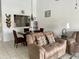 Inviting living room with comfortable seating and stylish decor, flowing into dining area at 4325 46Th W Ave # 202, Bradenton, FL 34210