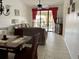 Cozy living and dining area featuring tile floors, neutral paint, comfortable seating, and natural light at 4325 46Th W Ave # 202, Bradenton, FL 34210