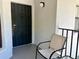 The unit has a front porch with a chair, perfect for sitting outside at 4325 46Th W Ave # 202, Bradenton, FL 34210