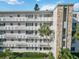 Building exterior with stone accents, balconies and lush landscaping with mature palms at 4440 Ironwood Cir # 508D, Bradenton, FL 34209