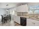 Kitchen with stainless steel dishwasher, granite countertop and eat-in dining area at 4440 Ironwood Cir # 508D, Bradenton, FL 34209