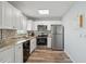 Modern kitchen featuring stainless steel appliances, granite countertops, and ample cabinet space at 4440 Ironwood Cir # 508D, Bradenton, FL 34209