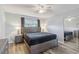 Bedroom features a ceiling fan, window, lamps and wooden furniture at 4440 Ironwood Cir # 508D, Bradenton, FL 34209