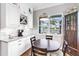 Charming breakfast nook with a view of the lake and custom cabinetry at 4625 Foxtail Dr, Parrish, FL 34219