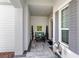 Inviting front porch with seating and decor at 4625 Foxtail Dr, Parrish, FL 34219