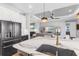 Spacious kitchen with a large center island, stainless steel appliances, and open floor plan at 4625 Foxtail Dr, Parrish, FL 34219