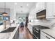 Open kitchen with breakfast nook, stainless steel appliances, and stylish countertops at 4625 Foxtail Dr, Parrish, FL 34219