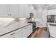 Well-appointed kitchen with white cabinetry, modern appliances, and elegant countertops at 4625 Foxtail Dr, Parrish, FL 34219