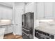 Kitchen with stainless steel appliances, custom cabinetry, and stylish backsplash at 4625 Foxtail Dr, Parrish, FL 34219