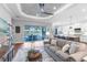 Open concept living area with water views, hardwood floors, and access to the kitchen and dining area at 4625 Foxtail Dr, Parrish, FL 34219