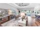Bright living room featuring hardwood floors, ceiling fan, waterfront views, and an open floor plan at 4625 Foxtail Dr, Parrish, FL 34219