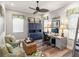 Bright office space with a ceiling fan, unique decor, and comfortable seating area at 4625 Foxtail Dr, Parrish, FL 34219