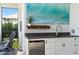 Outdoor kitchen featuring modern appliances and decor; perfect for entertaining guests at 4625 Foxtail Dr, Parrish, FL 34219