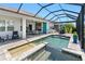 Beautiful pool with lake views, a tanning ledge, and outdoor dining areas at 4625 Foxtail Dr, Parrish, FL 34219