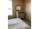 Bedroom featuring dresser, mirror, and a large window for natural light at 4802 51St W St # 2010, Bradenton, FL 34210