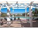 Community pool with plenty of lounge seating on a sunny day with blue skies at 4802 51St W St # 2010, Bradenton, FL 34210