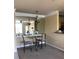 Dining room showcases a mirrored wall, decorative lighting, and modern seating at 4802 51St W St # 2010, Bradenton, FL 34210