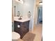 Bathroom featuring a vanity with a marble countertop, framed mirror, and tiled flooring at 5630 Golf Pointe Dr # 108, Sarasota, FL 34243