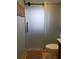 Bathroom featuring a glass shower door and stylish tiling at 5630 Golf Pointe Dr # 108, Sarasota, FL 34243
