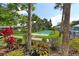 Well maintained community lawn area with landscaping and shuffleboard court in a quiet neighborhood at 5630 Golf Pointe Dr # 108, Sarasota, FL 34243