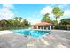 A sparkling community pool with ample seating and a covered pavilion for enjoyable outdoor gatherings at 5630 Golf Pointe Dr # 108, Sarasota, FL 34243