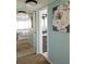 Hallway leading to the Primary bedroom and bathroom with tile floors and plenty of storage space at 5630 Golf Pointe Dr # 108, Sarasota, FL 34243